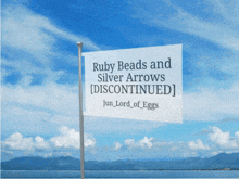 a sign that says ruby beads and silver arrows discontinued on it