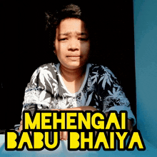 a woman is sitting in front of a sign that says " mehengai babu bahiya "