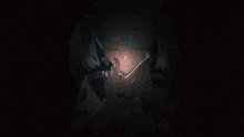 a girl with pigtails is holding a light in her hands
