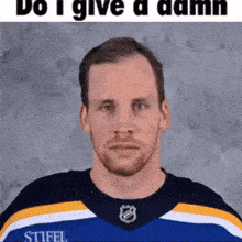 a man wearing a blue and yellow shirt with stifel on it
