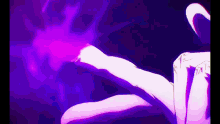 a purple light is coming out of a person 's hand .