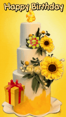 a birthday cake with yellow flowers and a candle that says " happy birthday "