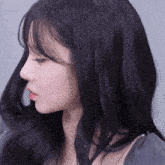 a close up of a woman 's face and hair