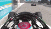 a race car is going down a track with a sticker that says stack here