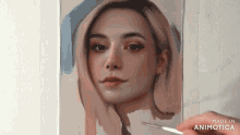 a painting of a woman 's face is being painted with a brush .