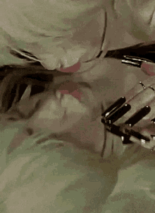 a close up of a woman 's face with a reflection in a mirror .