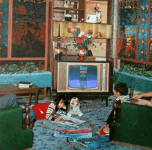 a group of people are sitting in front of a television that says panasonic