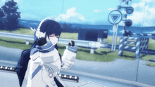 a girl in a futuristic outfit is standing in front of a train crossing sign
