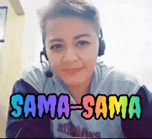 a woman wearing headphones and a shirt that says sama sama on it