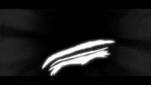 a black and white photo with a white circle in the middle of it .