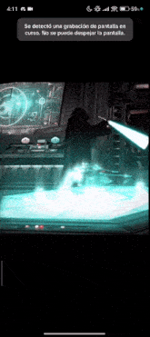a phone screen shows a man holding a lightsaber in front of a computer screen