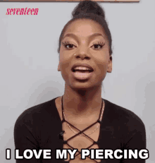 a woman says i love my piercing in front of a seventeen ad