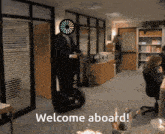 a man on a segway in an office with the words welcome aboard