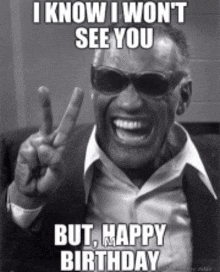 a black and white photo of a man wearing sunglasses giving a peace sign