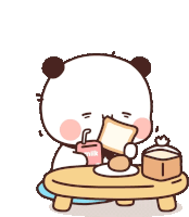 a cartoon panda bear is sitting at a table eating bread and drinking milk .