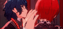 a person with red hair is touching another person 's face with their hand