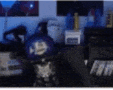 a blurred image of a room with a hat on a desk