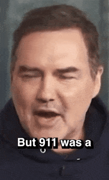 a close up of a man 's face with a caption that says but 911 was a .