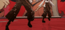 a couple of people standing on a stage with a red background