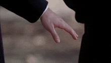 a close up of a man 's hand pointing
