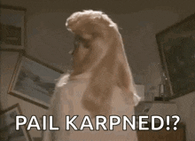a woman with blonde hair is standing in a room and says `` pail karpned ? '' .