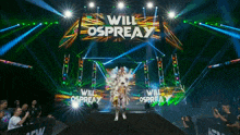 a wrestler named will ospreay is walking down a ramp