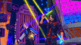 a man and a woman are standing in front of a stage in a video game holding glowing objects .