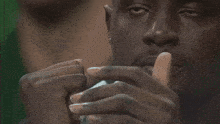 a close up of a man 's face with a blurred background