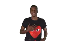 a man wearing a black shirt with a red heart and eyes on it