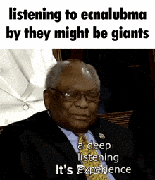 a man in a suit and tie says listening to ecnalubma by they might be giants