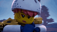 a close up of a lego character with a helmet on