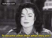 a black and white photo of michael jackson talking to someone .