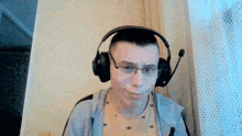 a man wearing headphones with a microphone on his head