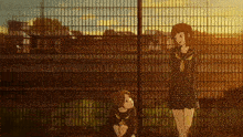 two anime girls standing next to each other behind a fence