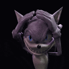 a close up of a purple object with horns on it