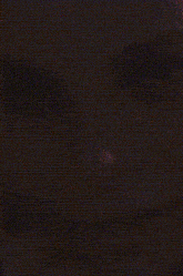 a close up of a person 's face in the dark