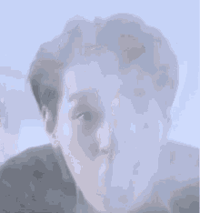 a close up of a person 's face with a smoke coming out of it .