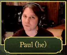 a picture of a man with headphones and the name paul ( he )