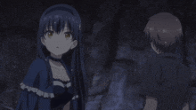 a man and a woman are standing next to each other and the woman is pointing at the man