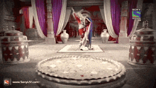 an advertisement for sony television shows a man holding a sword