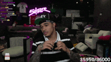a man wearing a boo boo hat is sitting in a living room