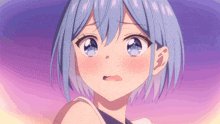 a close up of a girl with blue hair making a funny face