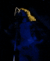 a poster for stairway to heaven tm shows a woman holding a microphone