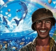 a man is smiling in front of a painting of dolphins and a rainbow