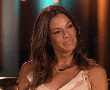 a woman wearing a necklace that says ' brooklyn ' on it