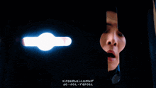 a person 's face is visible through a hole in a door with the words " do not repost " on the bottom