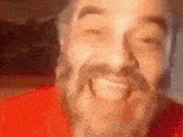a man with a beard is making a funny face with his mouth open .