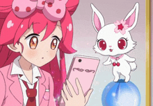 a girl with pink hair is looking at a pink phone next to a white rabbit