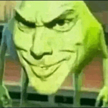 a close up of a green cartoon character 's face with a smiling face .