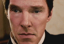 a close up of a man 's face with the name glenn cargo below him